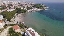 Inviting Bacvice Beach in Split, Croatia. Panorama of adriatic sea and cityscape