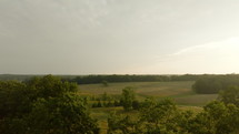 Aerial footage of Pasture at Sunrise in Rural Mississippi. Pasture in Carroll County Mississippi in the Summer at Dawn