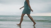 woman walking on a beach 