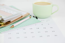 planner, calendar, pencil, and mug