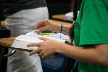 a girl in a Bible study classroom 