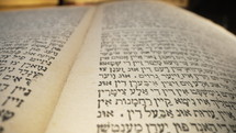 Exploring sacred jewish heritage scriptures on hebrew. Details of the Torah. Tradition and wisdom, macro footage. Letters and symbols. High quality 4k footage