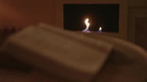 Open Bible by the Fireplace