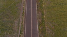 aerial view over an empty country road 