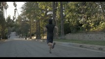 man running in a neighborhood 