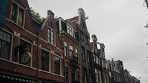 Facade Of Traditional Dutch Architecture In Amsterdam, Netherlands. handheld shot