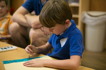 A boy using watercolors during children's church