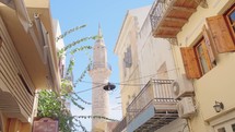 Crete streets in a summer day, Greece. Mosque Minaret

