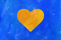 yellow heart on a blue background 