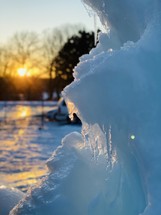 melting ice and snow at sunrise 