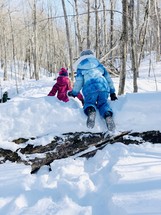 children playing outdoors in snow 
