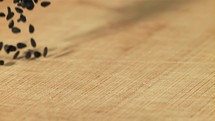 Falling sesame seeds on the table.