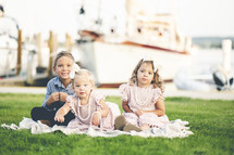 family portrait in front of a marina 