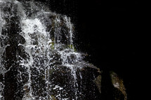 waterfall cascading down rocks fast shutter speed