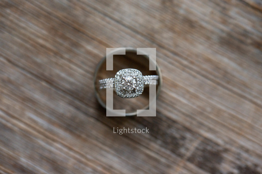 wedding rings on a wood background 
