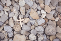 cross on pebbles 