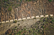 chains to prevent rockslides on a mountainside 