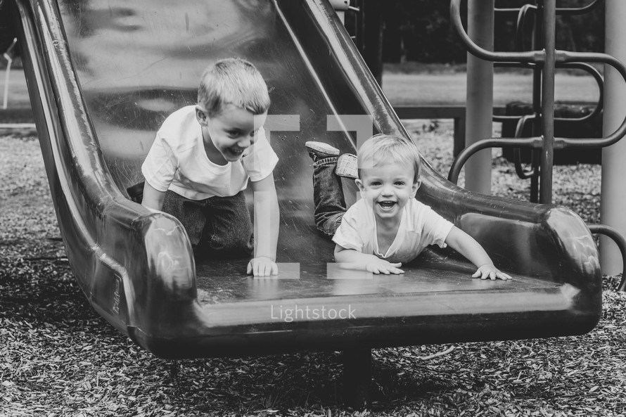 brothers on a slide 