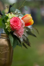 flowers in a gold mason jar 