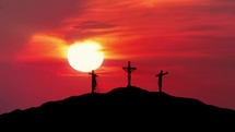 "Silhouettes of three crosses on top of a hill at magnificent sunset. 
Concept of the Crucifixion of Christ."
