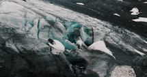 Exploring Ice Caves In The Vinciguerra Glacier Near Ushuaia, Tierra del Fuego Province, Argentina. Aerial Drone Shot