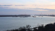 Motion Timelapse Of Boats Sailing On Danube River At The Port Of Galati In Romania On A Sunset, wide shot