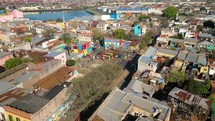 Aerial view of Benito Quinquela Martín museum, located in La Boca neighborhood in Buenos Aires. Drone flying over Matanzas river and slowly descending
