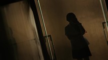 Girl walking in the dark
