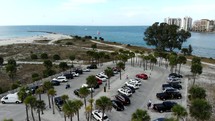 cars in a parking lot at a beach public access 