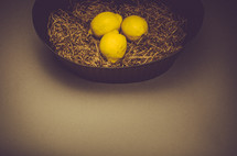 3 lemons in a basket