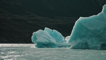Blue Iceberg Floats In The Sea, Lago Argentino, Patagonia - POV	