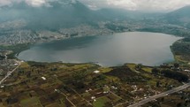Aerial panoramic shot of Laguna de San Pablo And Its Surroundings In Otavalo, Ecuador.