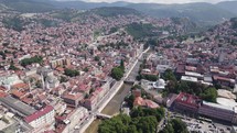 Aerial Panorama: Sarajevo Cityscape with Miljacka River Flow