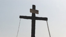 Cross with ropes and inscription - close
