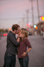 Couple kissing on a street