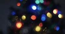 Abstract Christmas tree lights bokeh, blurred, holidays motion background.