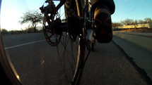 Low angle bicycle riding POV on a road with traffic