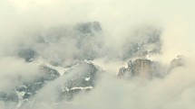 clouds and fog over mountain peaks 