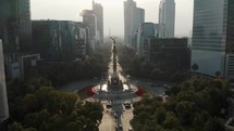 Angel of Independence, Victory Column In Roundabout With Skyline In The Background In Mexico. - aerial	