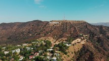 drone is flying towards hollywood sign