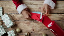 Santa opens letters full of money for presents
