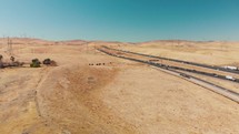 Drone follows a highway through the desert