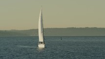 Sailboat on open water, slow-motion