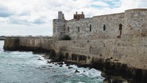 Detail of Castle of Meniace in Siracusa Ortigia Island on the sea