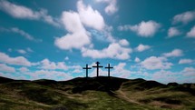 Three crosses on the hill with clouds moving on blue starry sky. Easter, resurrection, new life, redemption concept.