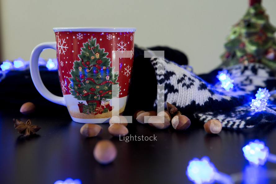 blue glowing string of lights and coffee mug 