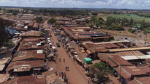 aerial view over rooftops and market 