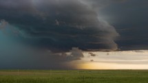 Timelapse of Storm Clouds Full of Color Moving Across Beautiful Open Plains.