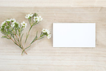 flowers and blank white notecard