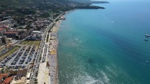 Aerial shot drone flies over beaches south of Cefalu, Sicily, Italy